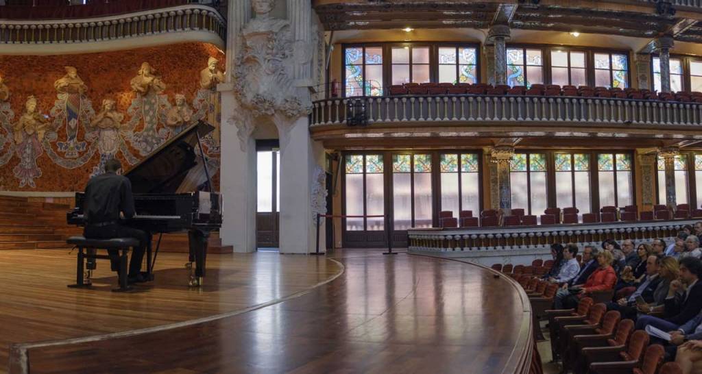 A pianist performing before an audience