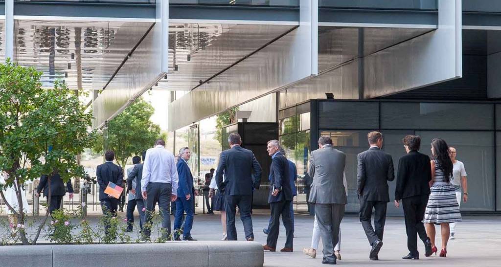 People entering a Repsol building. Action plans.